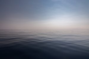 calm ocean with blue sky - Karuna Counselling